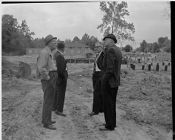 Men standing on construction site 